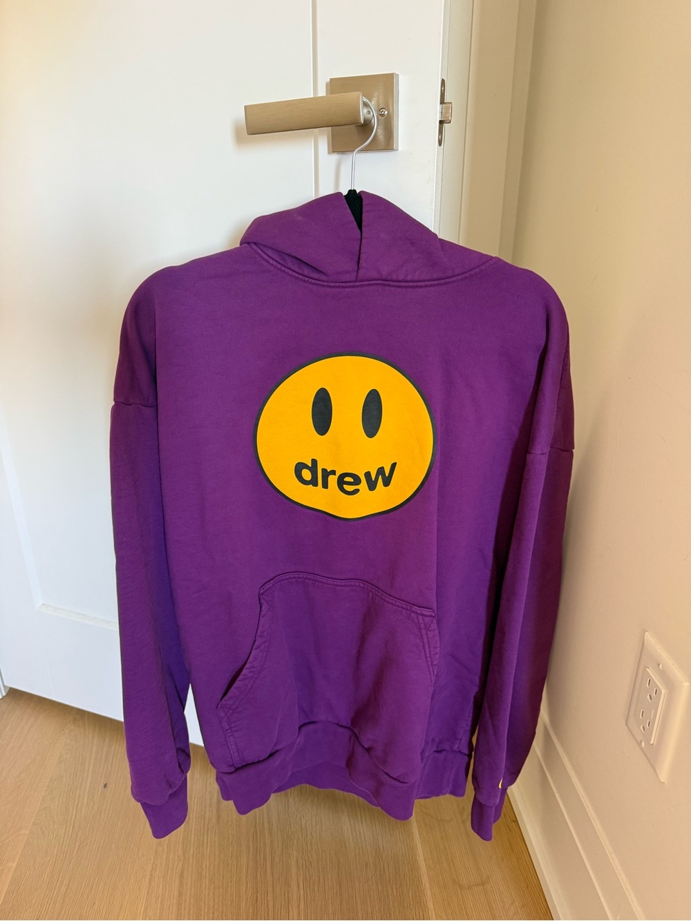 drew house purple hoodie with yellow smiley logo
